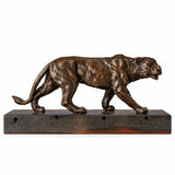 Handcrafted bronze walking lioness sculpture in a powerful striding pose with detailed muscular form