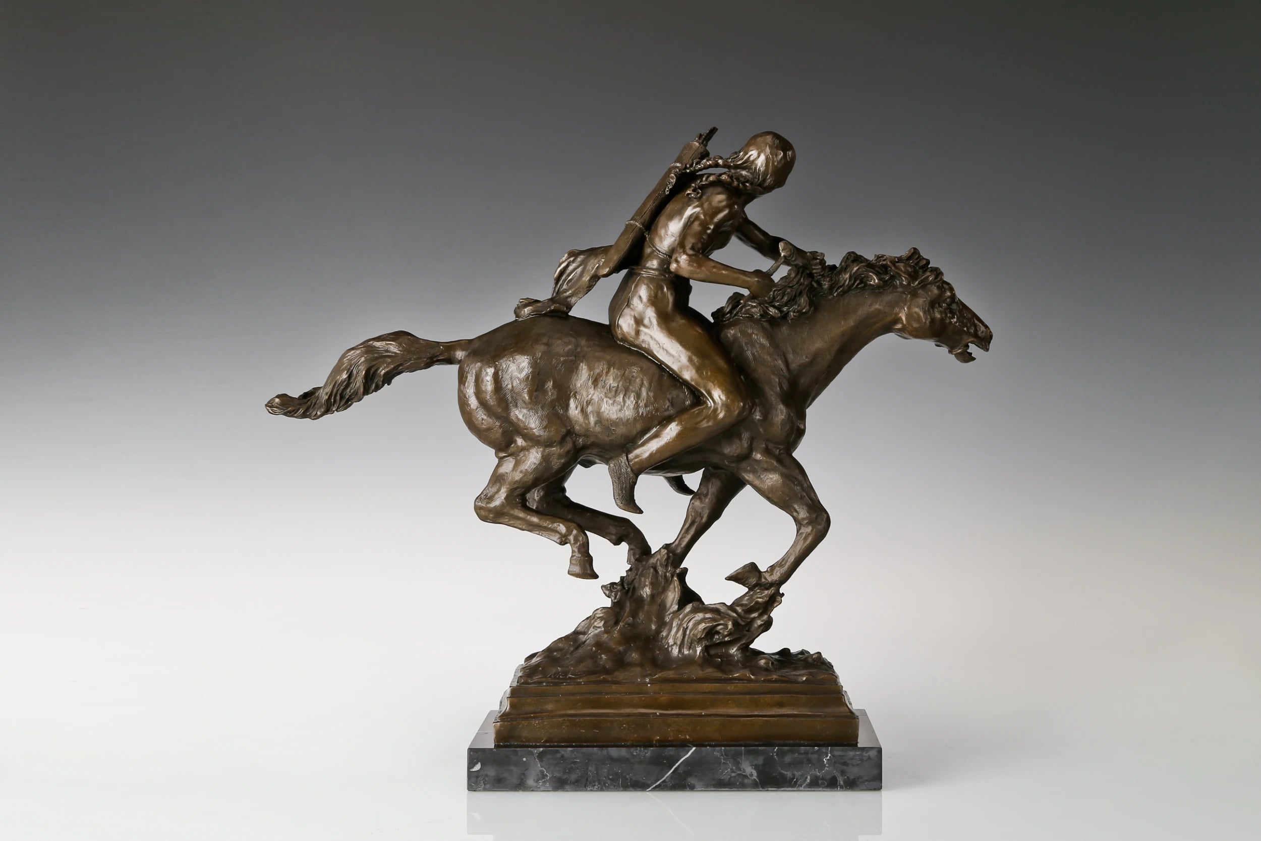 Right side view of Western bronze horse rider statue with detailed equestrian form