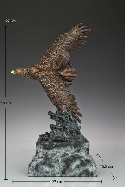 Bronze eagle sculpture with wings spread, capturing a powerful takeoff moment. A bold statue symbolizing strength, freedom, and ambition.