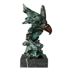 bronze eagle head sculpture with striking verdigris patina and marble base. A bold wildlife statue symbolizing freedom, strength, and vision.