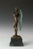 Side view of Winged David bronze sculpture showing detailed wings