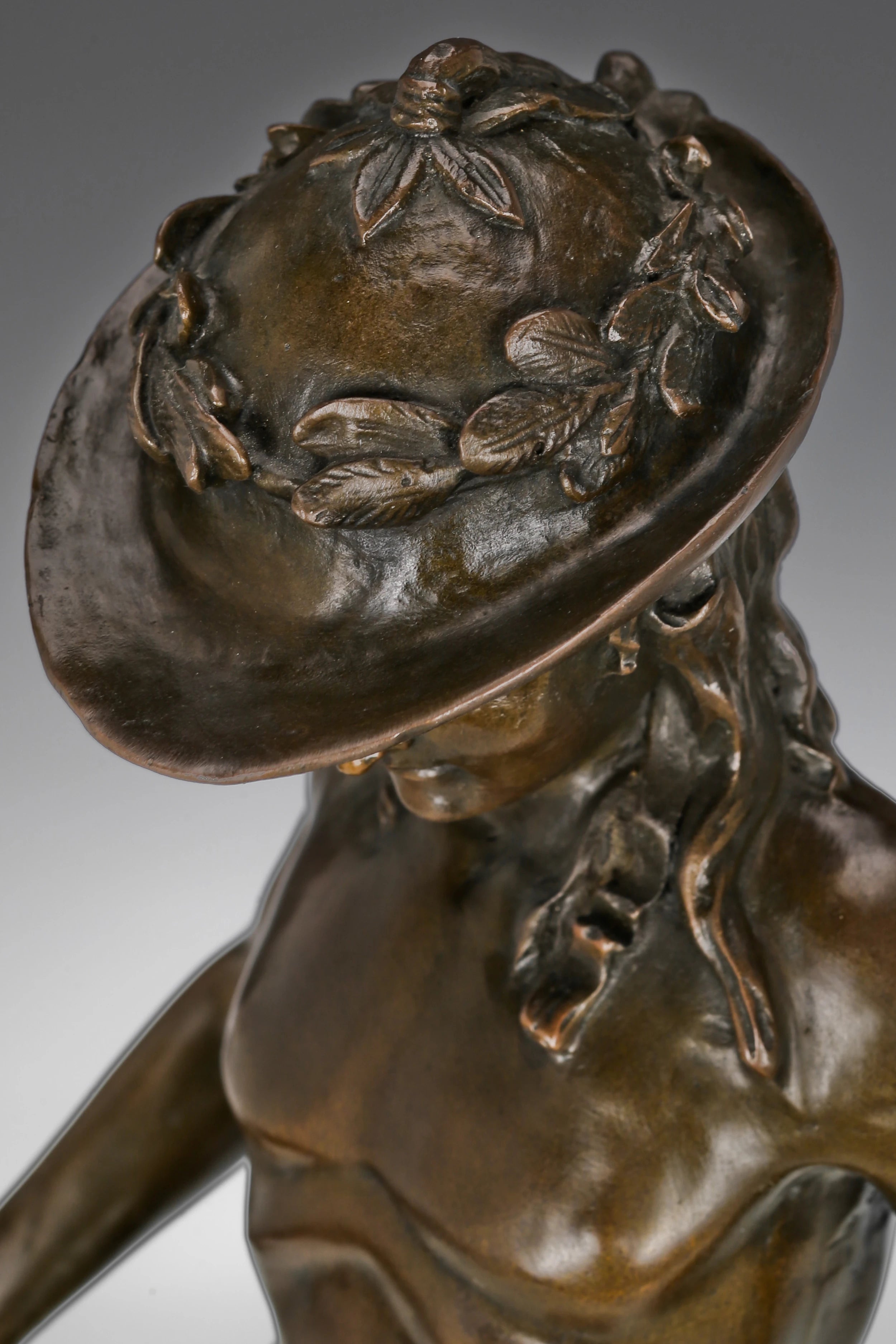 Close-up detail of Young David bronze statue with sword and hat